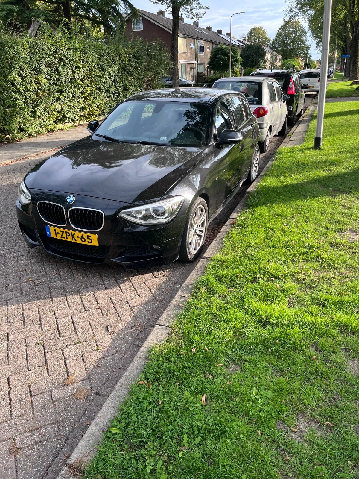 BMW 1-Serie 114I 75KW 5-DR 2015 Zwart, Ophalen