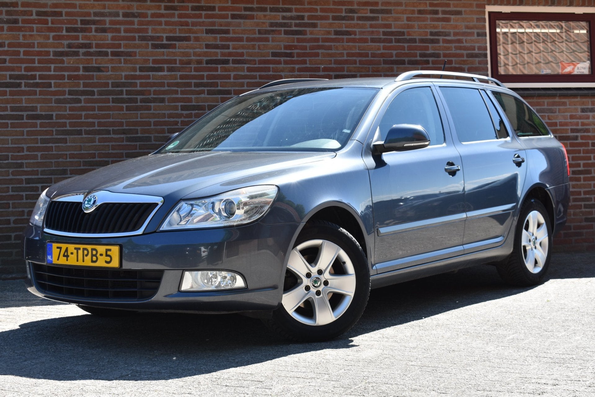 Skoda Octavia Combi 1.6 TDI Greentech Ambition Business Line, Auto's, Skoda, Voorwielaandrijving, Stof, Gebruikt, Zwart