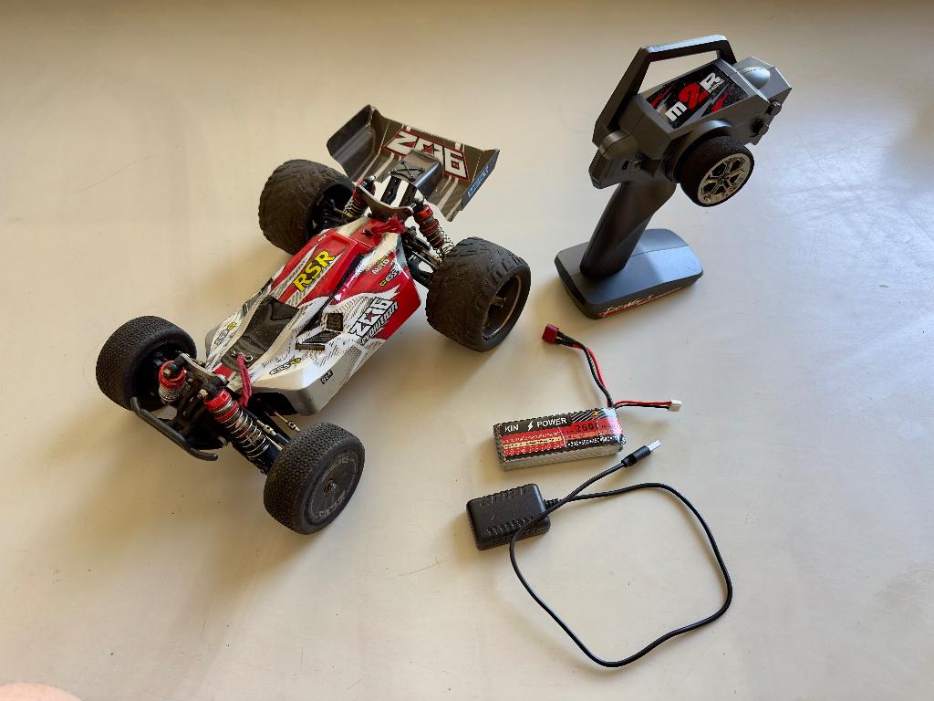 Wltoys 144001 RC buggy met 4-wielaandrijving, Hobby en Vrije tijd, Modelbouw | Radiografisch | Auto's, Elektro, Gebruikt, Verzenden