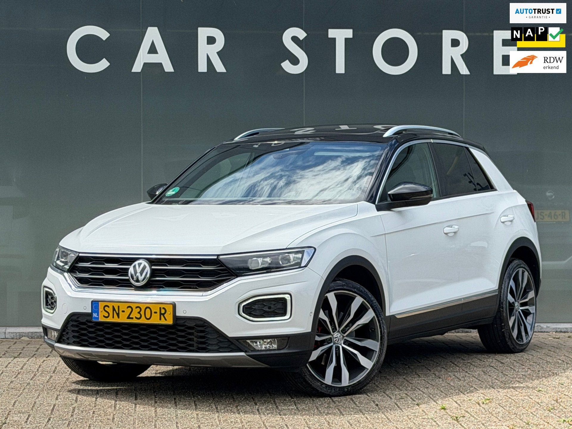 Volkswagen T-Roc 2.0 TSI 4Motion Sport Pano / Beats / Camera, Auto's, Volkswagen, Automaat, Gebruikt, 1984 cc, Wit