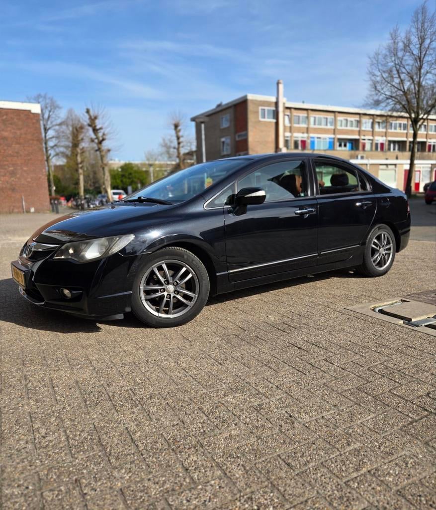 Honda Civic 1.3 95pk CVT 2010 Zwart, Auto's, Zwart, Bruin, 22 km/l, Sedan