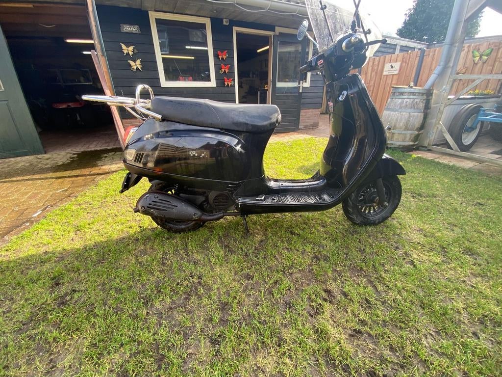Zwarte scooter, Ophalen of Verzenden