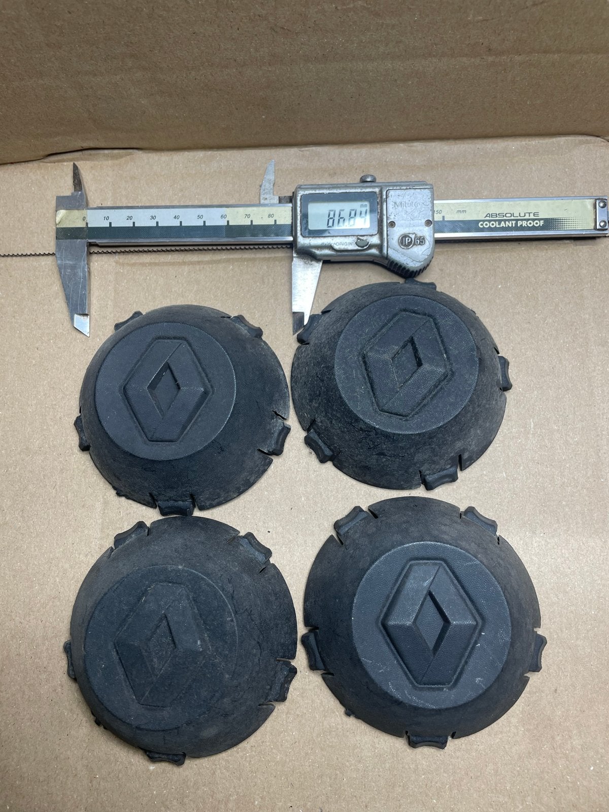 Set van 4 originele Renault naafdoppen 8200 381 353, Auto diversen, Ophalen of Verzenden, Gebruikt