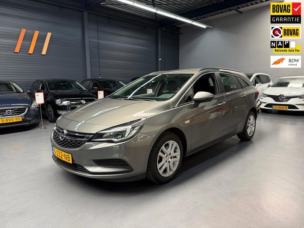 Opel Astra Sports Tourer 1.4 Turbo Business+ DEALER ONDERHOU, Auto's, Voorwielaandrijving, Gebruikt, Euro 6, 4 cilinders