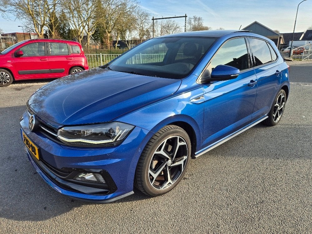 Volkswagen Polo 1.0 TSI R-line 115pk Automaat, Auto's, Dealer onderhouden, Stof, 1095 kg, Blauw