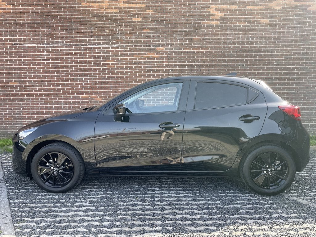 Mazda 2 1.5 e-SkyActiv-G 90 Homura (bj 2024), Auto's, Mazda, 12 maanden, Stof, 4 cilinders, Zwart