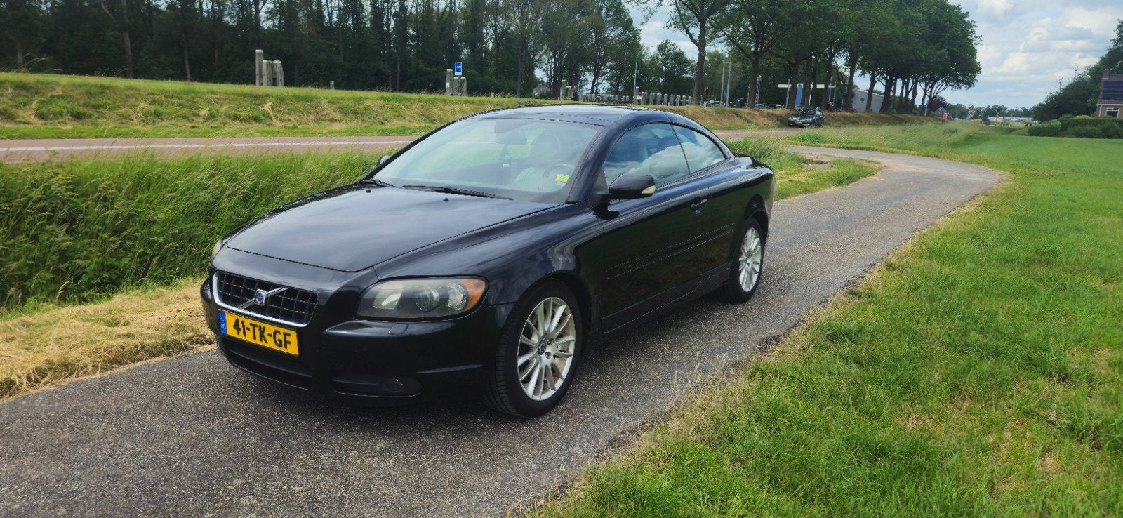 Volvo C70 2.4 D5 Geartronic 2006 Zwart, Auto's, C70, 197 €/maand, Zwart, Overige kleuren