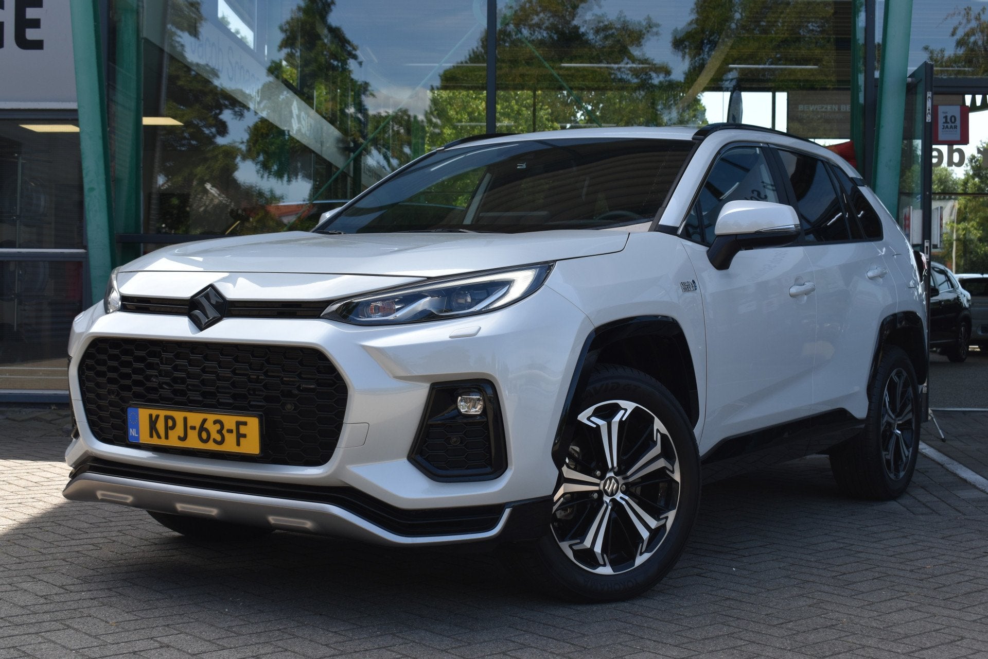 Toyota RAV4 (Suzuki) 2.5 Plug-in Hybrid AWD Style Limited Au, Zwart, 4 cilinders, Leder en Stof, Wit