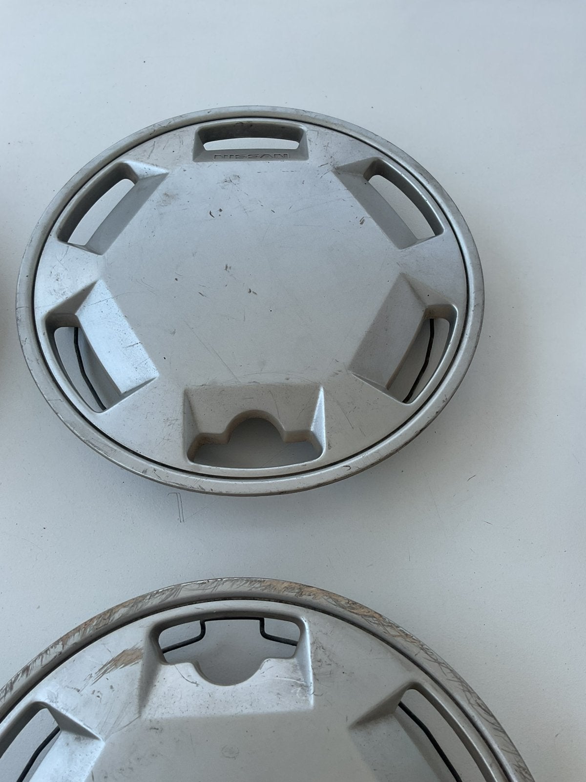 Nissan originele wieldoppen 12 inch van Nissan Micra 1970/90, Auto diversen, Wieldoppen, Ophalen, Zo goed als nieuw