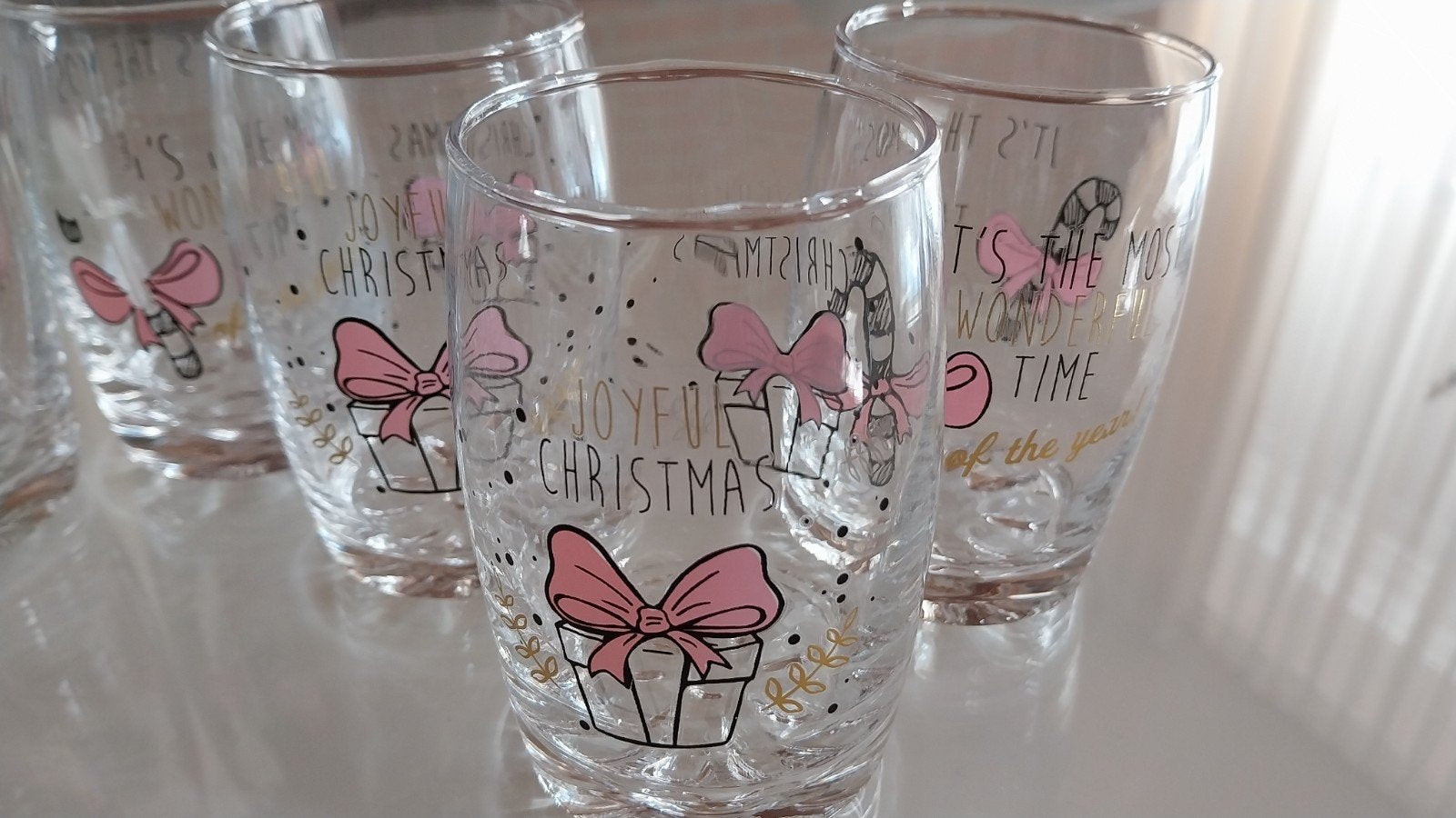 Set van 6 kerstglazen met feestelijke opdruk, Ophalen of Verzenden, Zo goed als nieuw, Glas, Meerkleurig