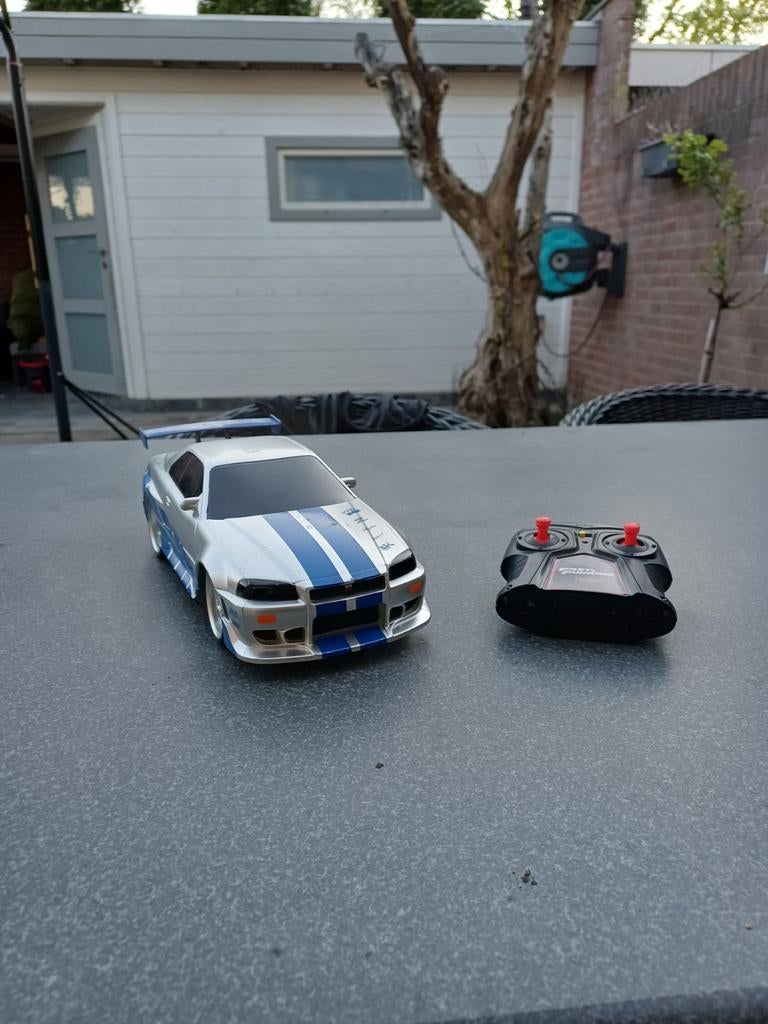 Nissan Skyline R34 R/C Auto - Goede Staat, Hobby en Vrije tijd, Modelbouw | Radiografisch | Auto's, Gebruikt, Auto onroad, Overige schalen