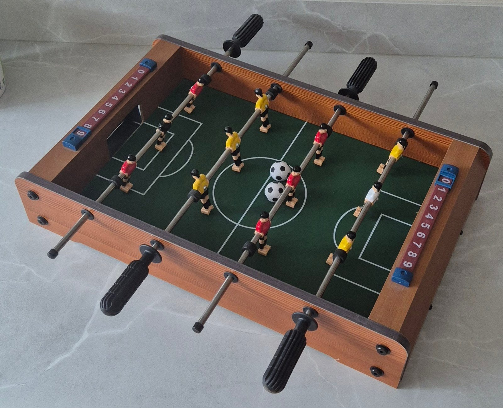 Mini tafelvoetbal, Ophalen