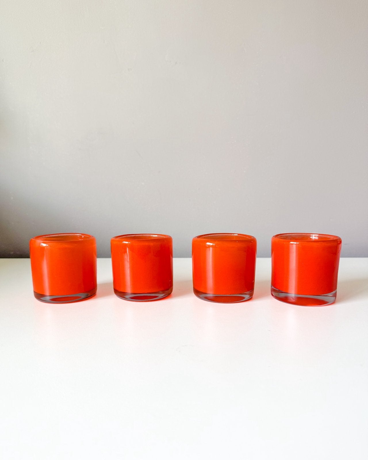 4 vintage glazen waxinelichthouders | Jaren 70, Huis en Inrichting, Waxinelichthouder, Oranje, Ophalen of Verzenden, X