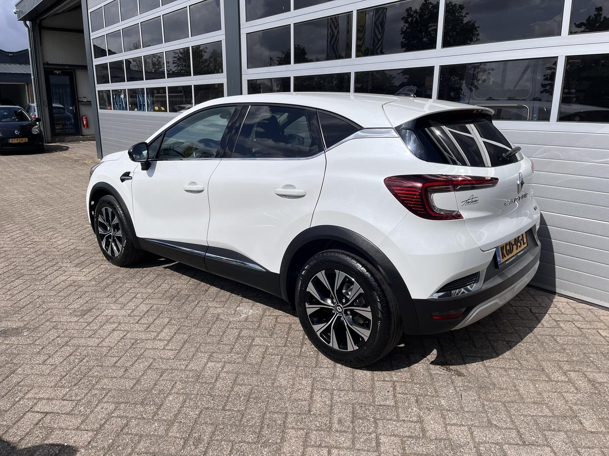 Renault Captur 1.6 E-Tech Hybrid 145 Intens, Auto's, 12 maanden, Gebruikt, Leder en Stof, Wit
