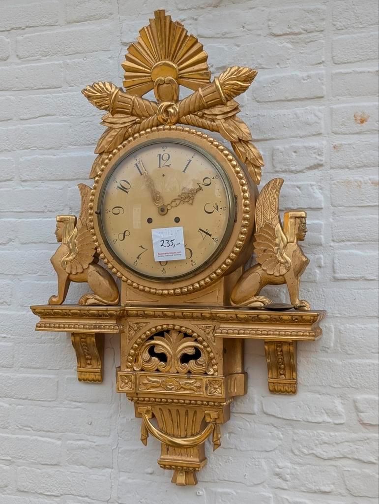 Antieke houten vergulde Cartel klok. €235.  80x50 cm, Ophalen