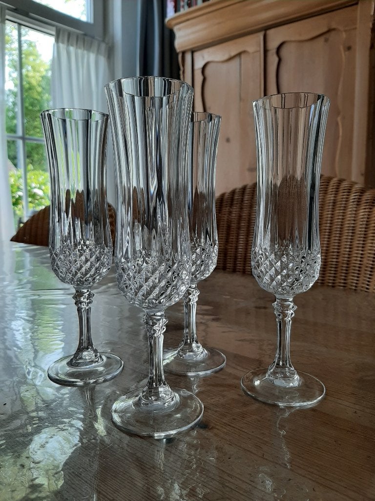 CRISTAL `D ARQEUS , LONGCHAMP - 4 CHAMPAGNE GLAZEN - KRISTAL, Ophalen of Verzenden, Zo goed als nieuw, Overige stijlen, Overige materialen