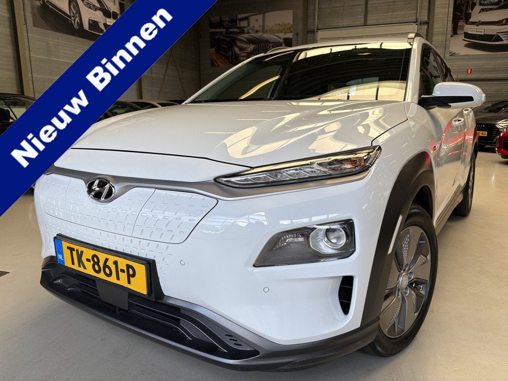 Hyundai KONA EV Premium 64 kWh Head up display, Warmtepomp, Auto's, Hyundai, Gebruikt, Automatische klimaatregeling, Wit, SUV of Terreinwagen