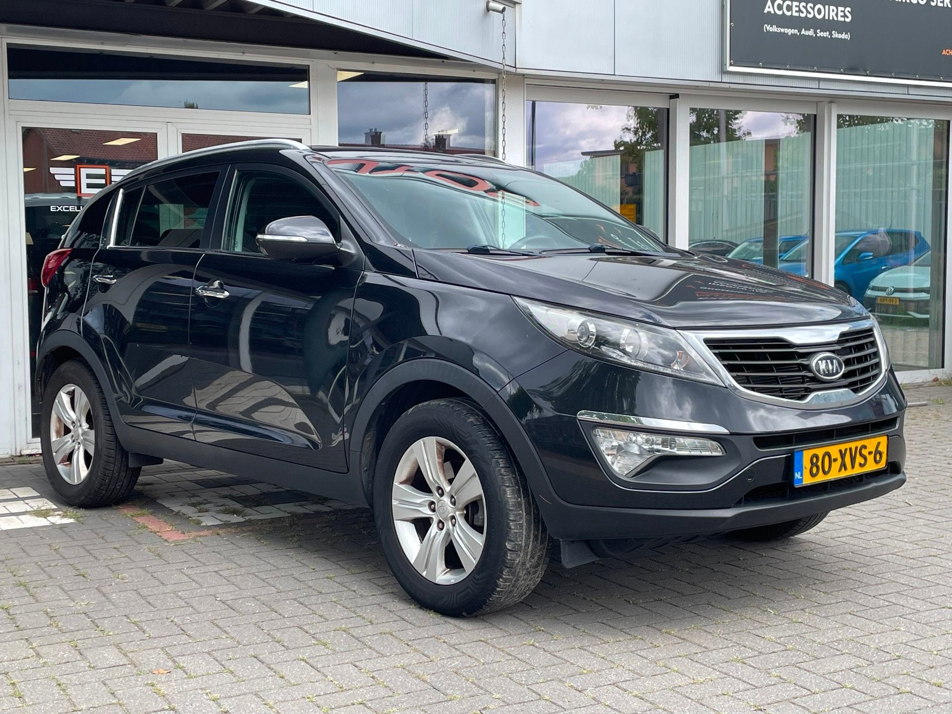 Kia Sportage 2.0 X-ecutive Plus Pack Automaat, Auto's, Gebruikt, Zwart, 4 cilinders, Leder en Stof