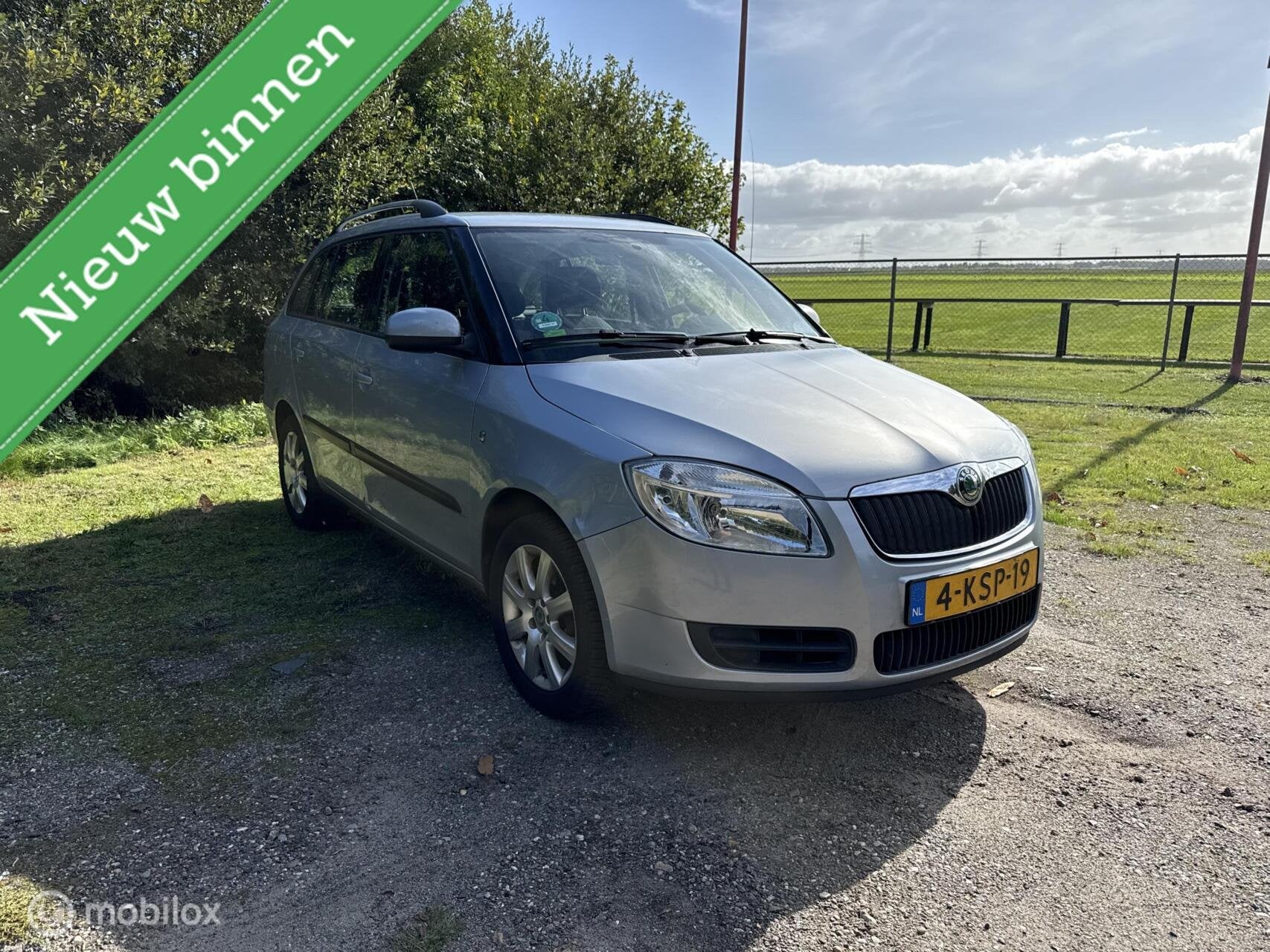 Skoda Fabia Combi 1.4-16V Ambition Business Line, Auto's, Voorwielaandrijving, Euro 5, 4 cilinders, Blauw