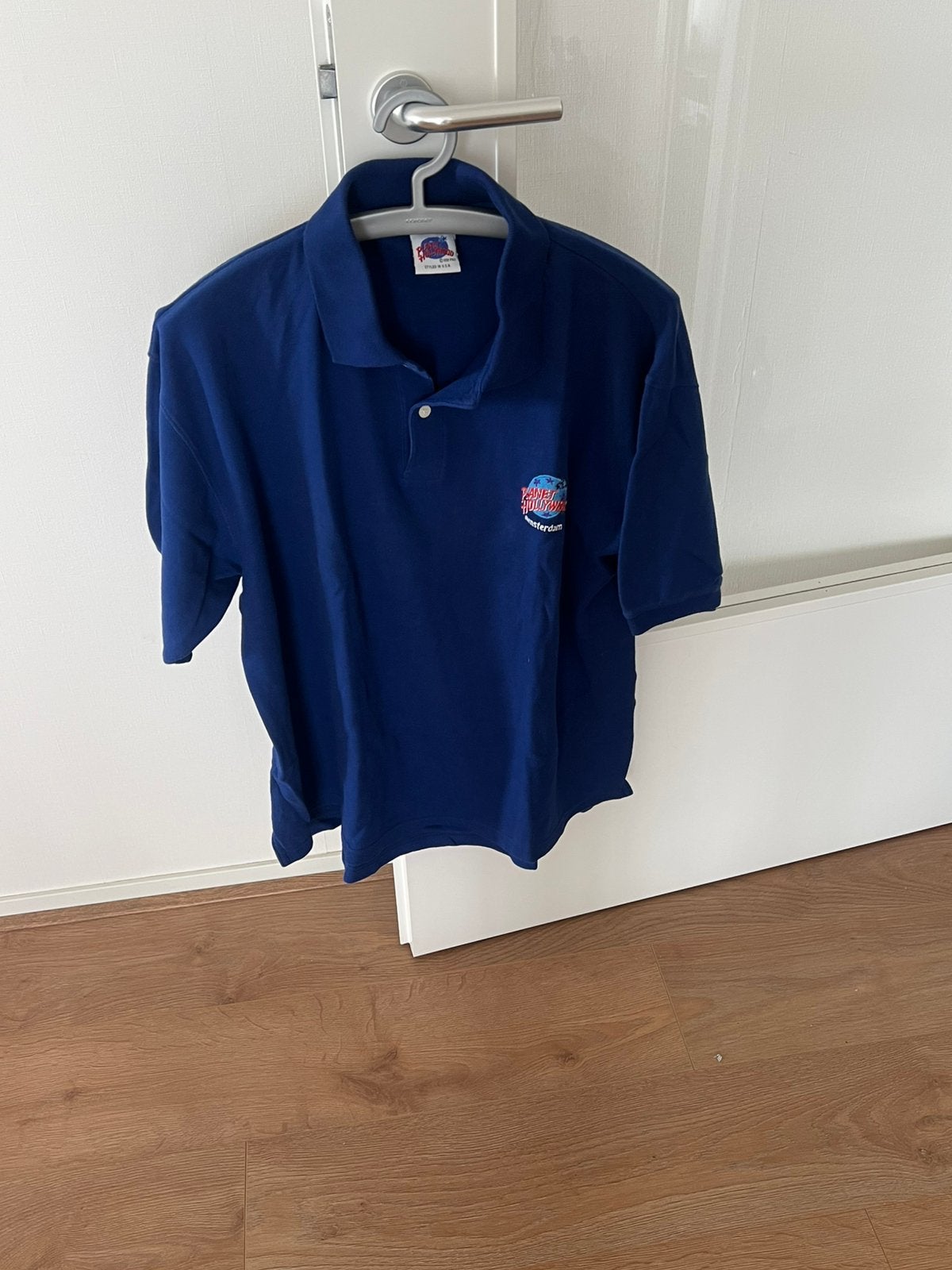 Heren Polo Planet Holywood Amsterdam, Ophalen of Verzenden, Zo goed als nieuw, Maat 56/58 (XL), Blauw