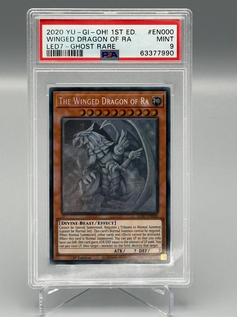 PSA 9 – Winged Dragon of Ra Ghost Rare 1st Edition Yu-Gi-Oh, Verzenden, Zo goed als nieuw, Losse kaart, Foil