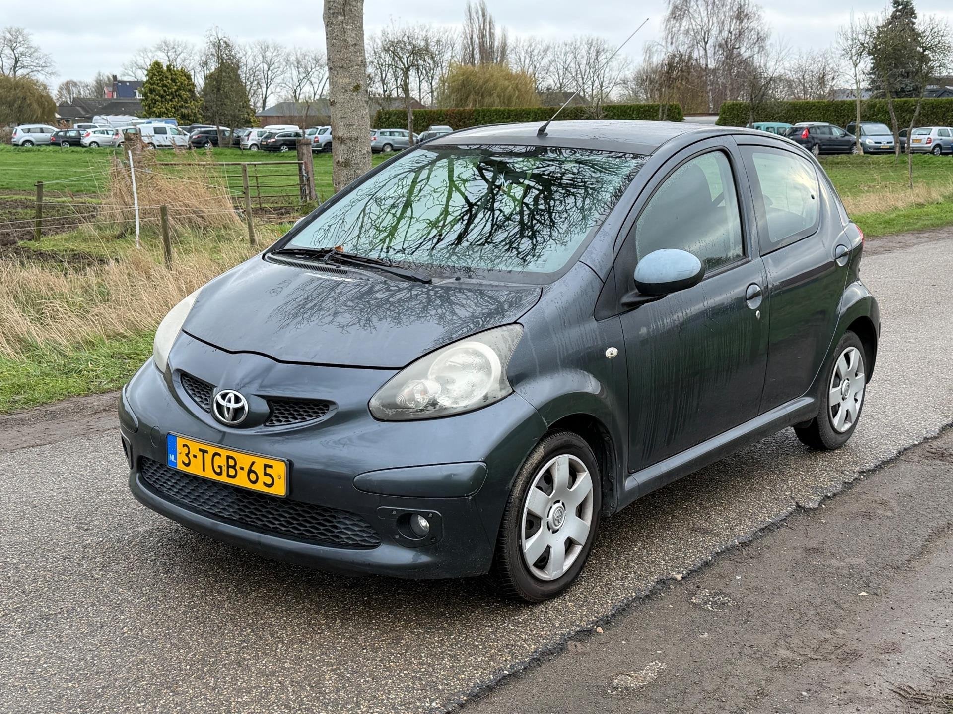Toyota Aygo 1.0-12V LEES TEKST! GEEN APK Airco 5Drs NAP, Voorwielaandrijving, Stof, Gebruikt, Zwart