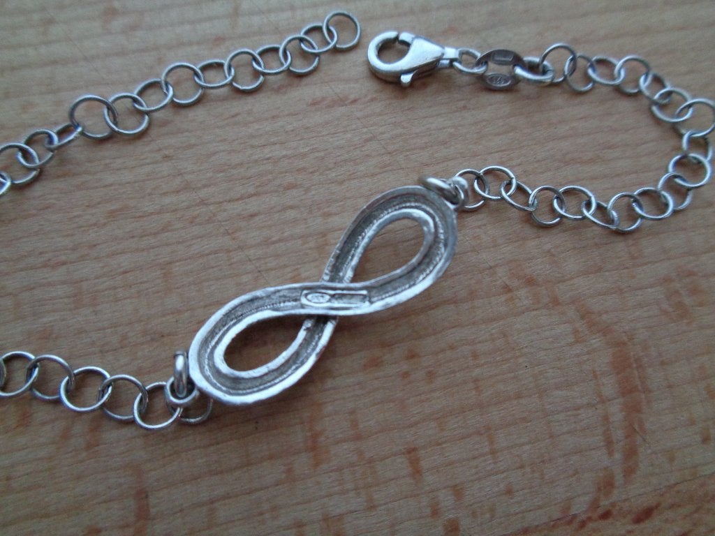 zilveren infinity armband [1113], Verzenden, Zo goed als nieuw, Zilver, Zilver