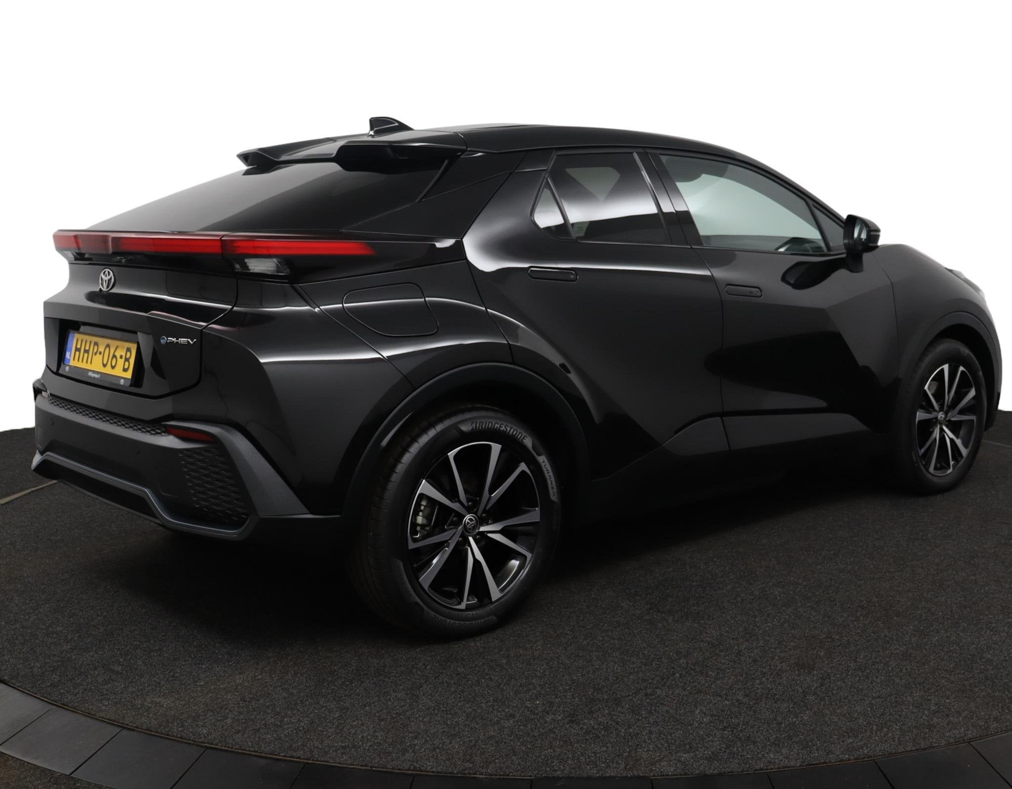 Toyota C-HR 2.0 Plug-in Hybrid 220 Dynamic | Stoel en Stuurv, Auto's, 4 cilinders, Zwart, Bedrijf, Grijs