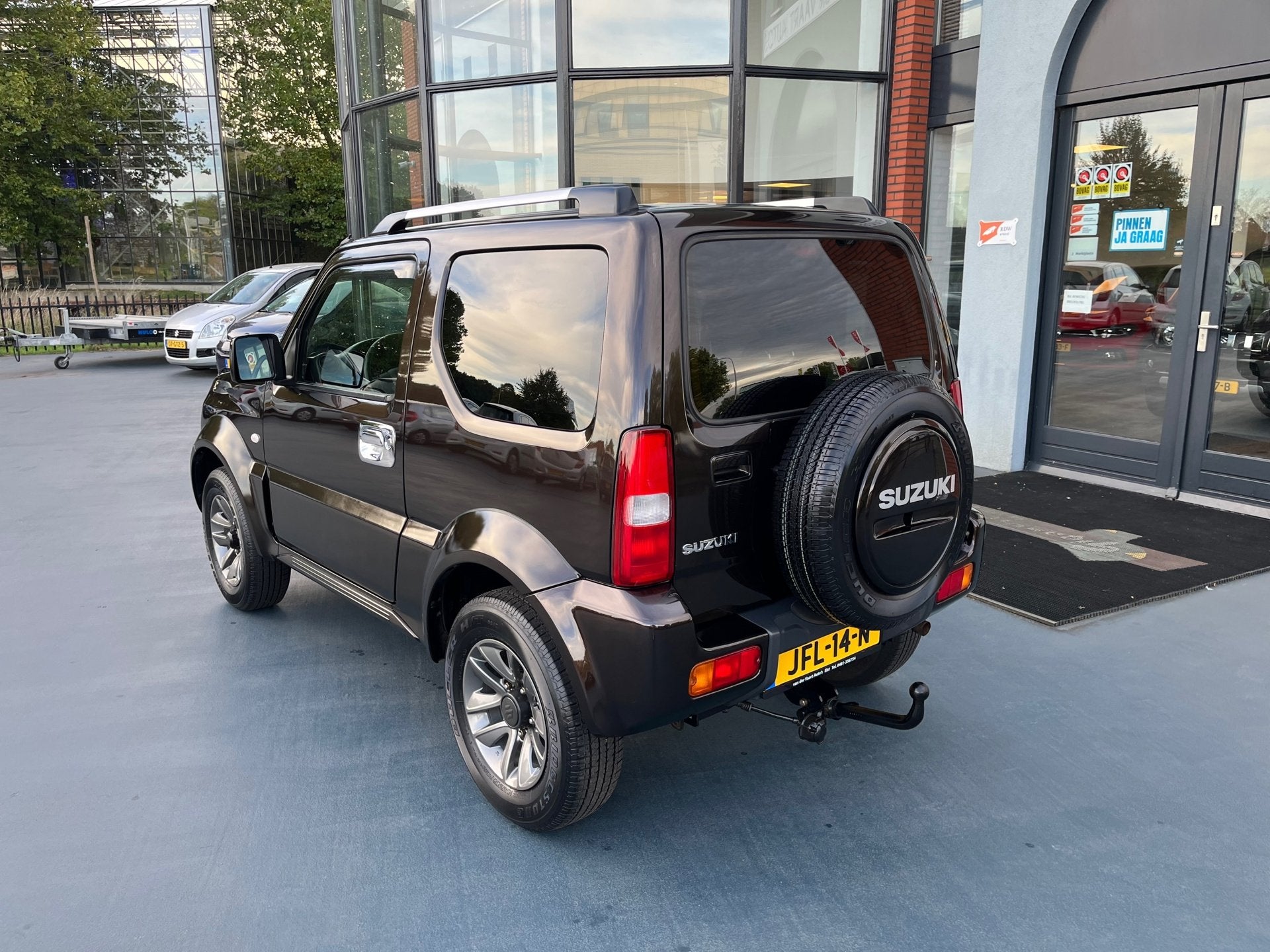Suzuki JIMNY 1.3 Exclusive 4X4 LEDER STOELVERWARMING AIRCO L, Auto's, Suzuki, Euro 5, Gebruikt, Bruin, 4 stoelen