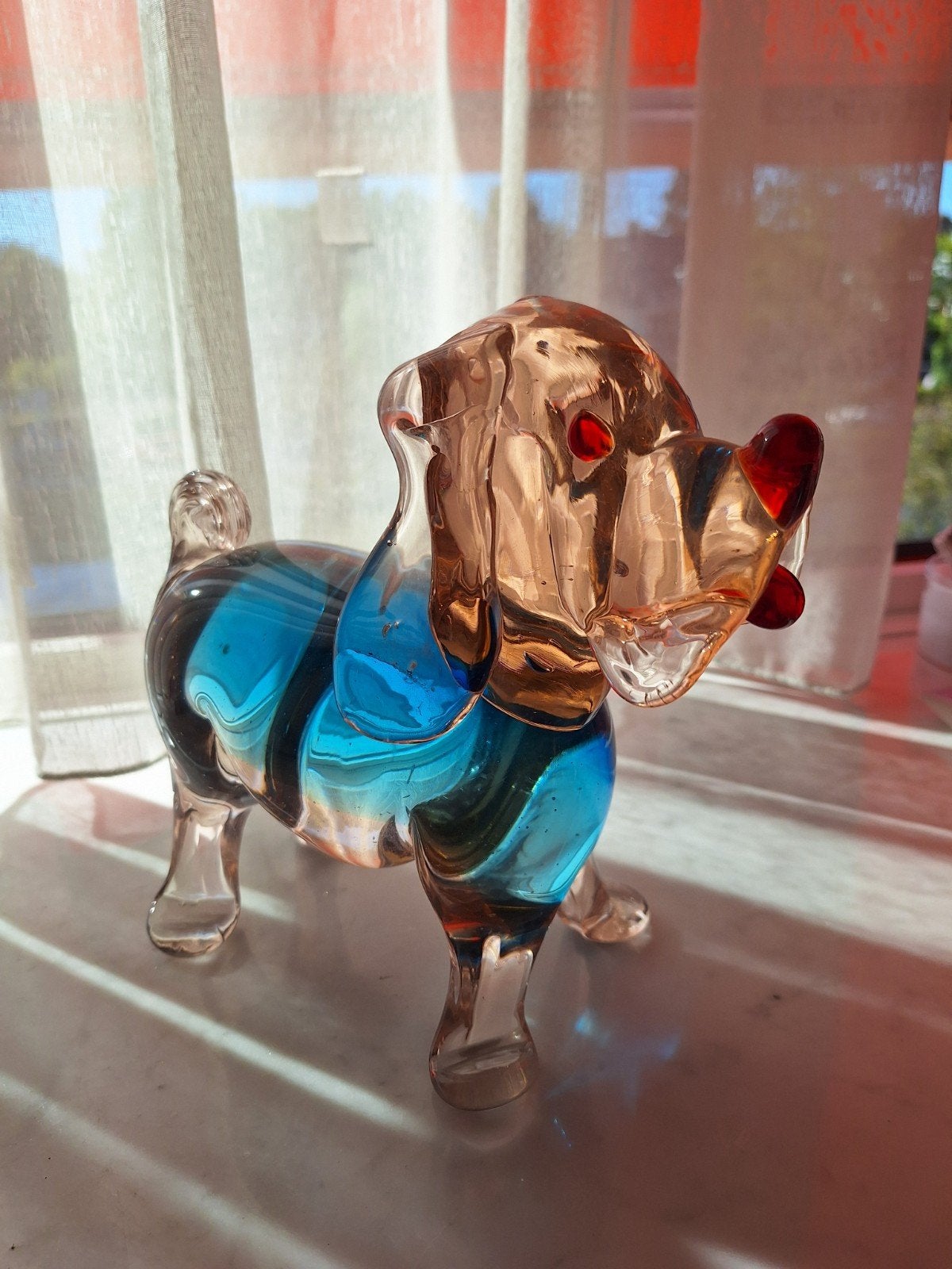 Glazen hondje, blauw en amberkleurig Murano, Ophalen