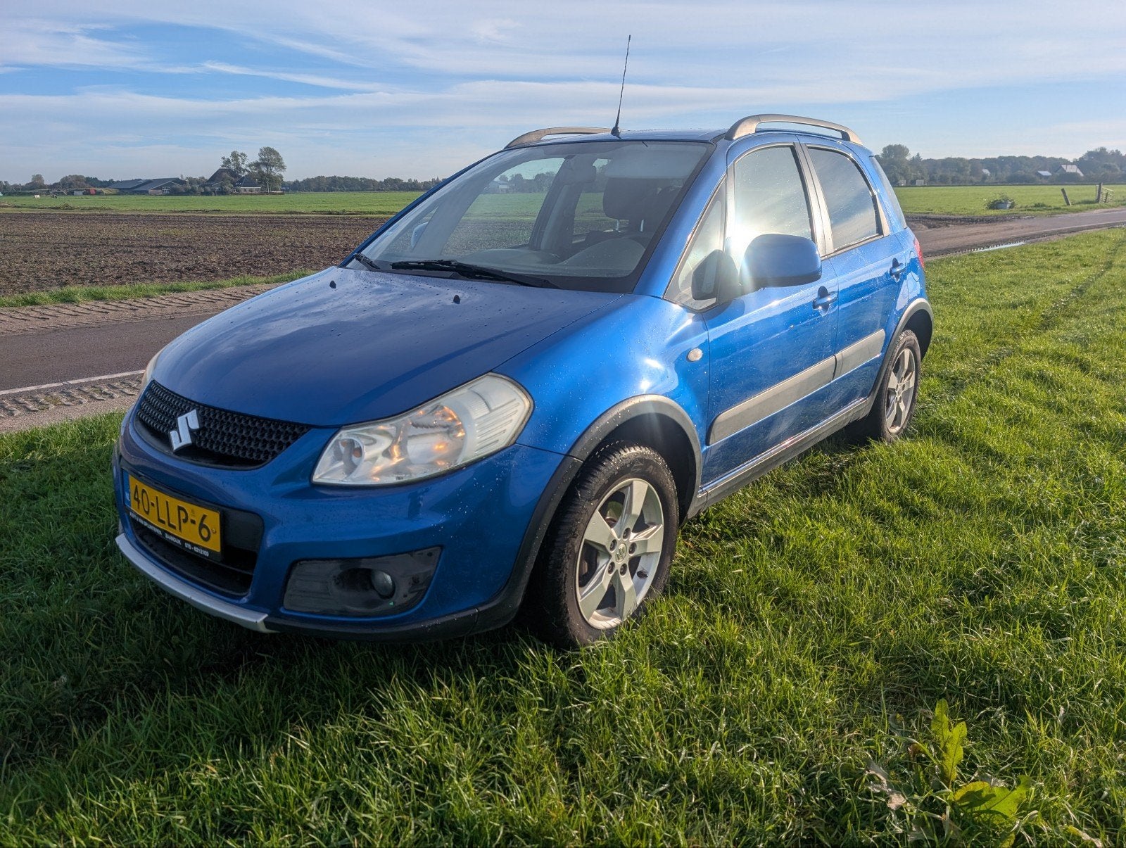 Suzuki SX4 1.6i AWD Exclusive 2010 Blauw, Auto's, Dealer onderhouden, 4 cilinders, Traction-control, Origineel Nederlands