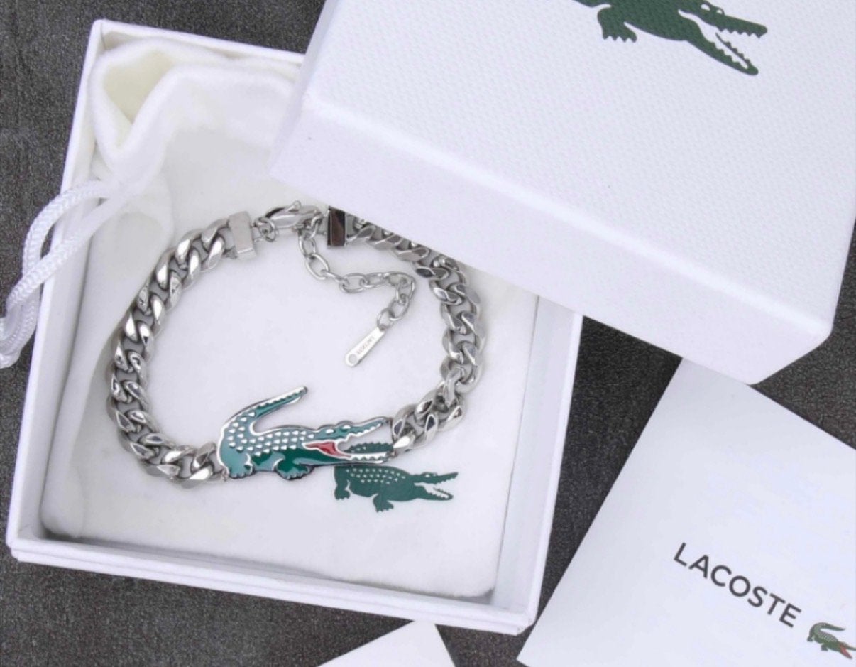 Nieuw Lacoste armband met krokodil logo, Nieuw, Ophalen of Verzenden, Met strass, Overige kleuren