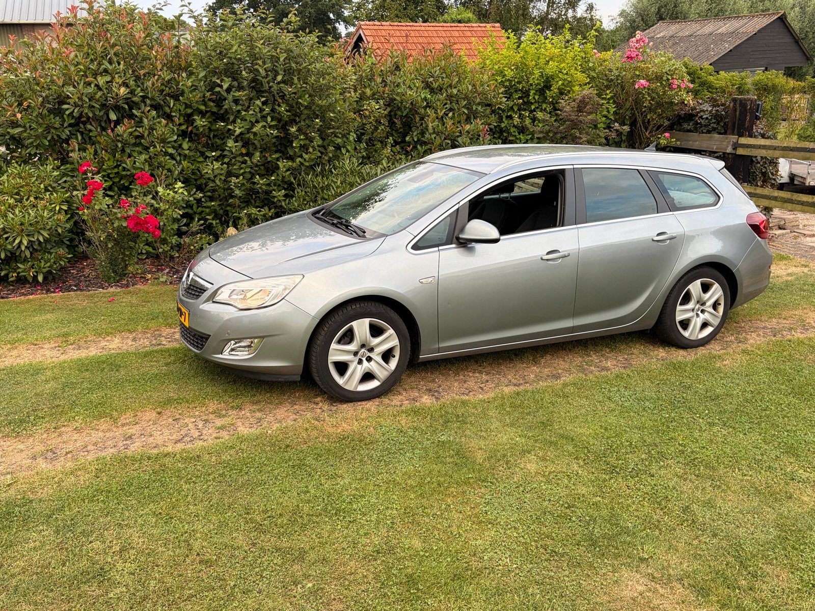 Opel Astra 1.4 Turbo 88KW Sports Tourer 2011 Grijs, Auto's, Voorwielaandrijving, 4 cilinders, 1337 kg, Origineel Nederlands