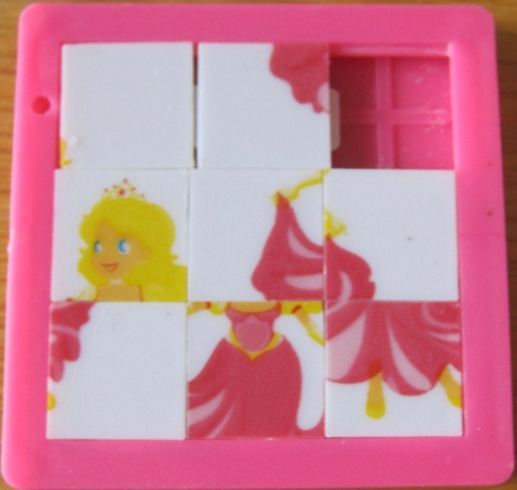 roze schuifpuzzel - schuifspelletje met prinses, Ophalen of Verzenden, Minder dan 500 stukjes, Zo goed als nieuw, Overige typen