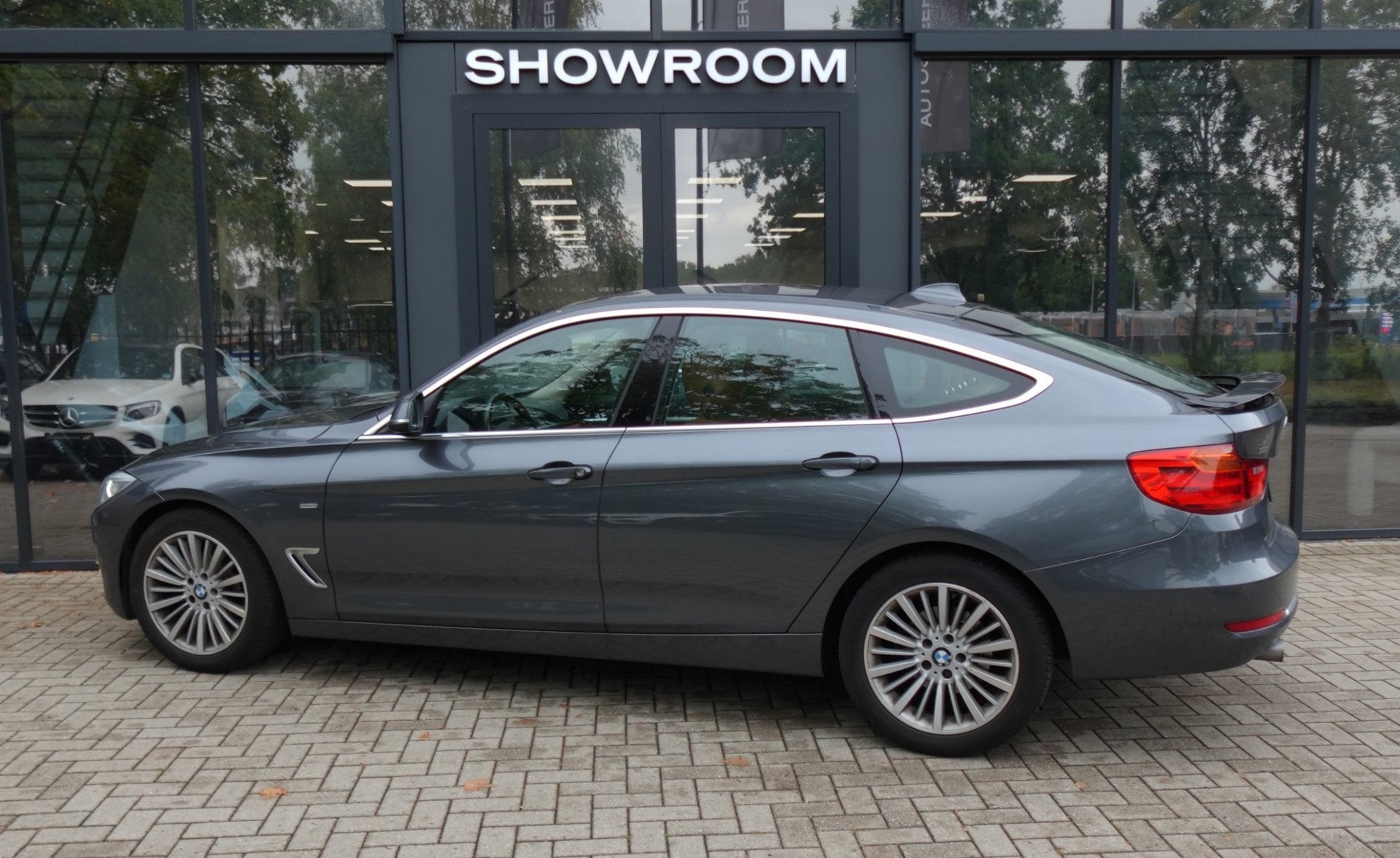BMW 3-serie Gran Turismo 320i High Executive NAVI LEDER PCD, Auto's, BMW, Automaat, Achterwielaandrijving, Gebruikt, Euro 6