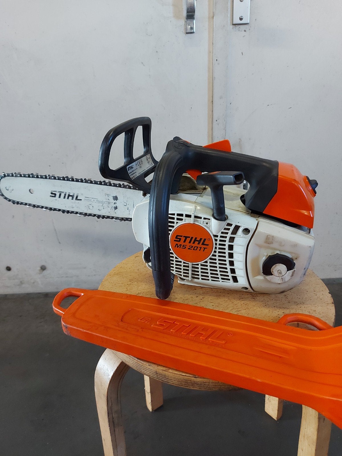 stihl ms 201 T tophendel zaag, Ophalen