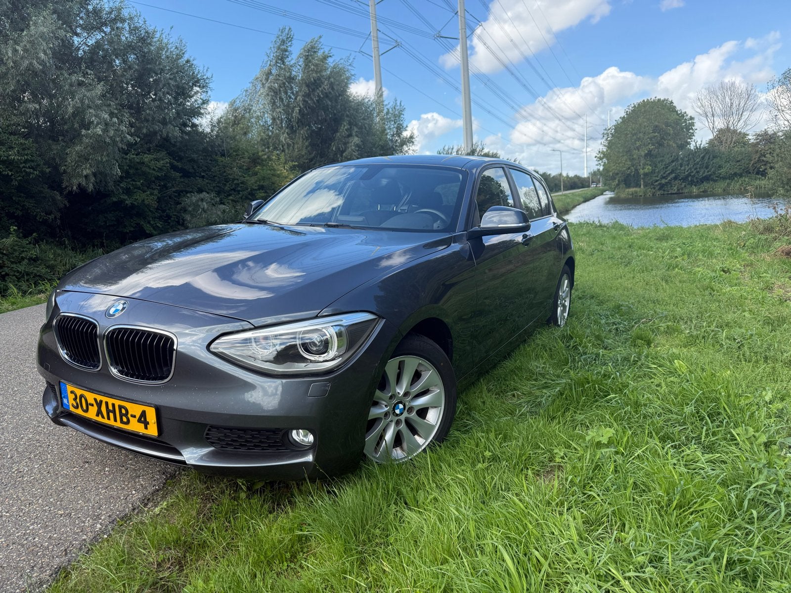 BMW 1-Serie 116I 100KW 5DR Aut8 2012 Grijs, Auto's, 4 cilinders, Origineel Nederlands, 1200 kg, 650 kg