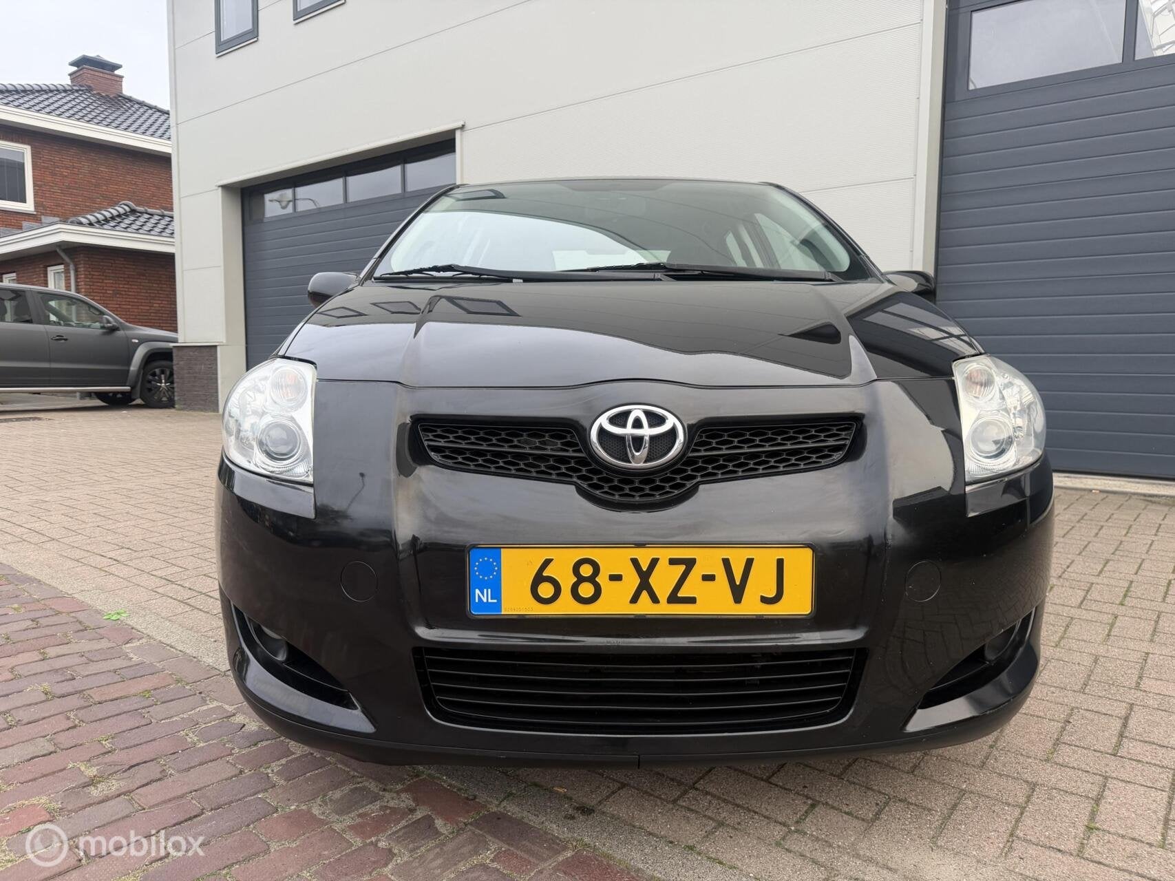 Toyota Auris 1.6-16V Sol Business AUTOMAAT/NAVI/CRUISE/TREKH, Auto's, 450 kg, Gebruikt, 4 cilinders, Zwart