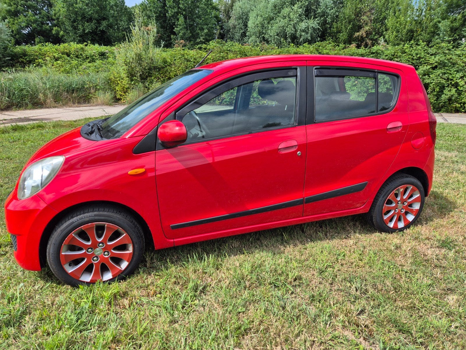 Daihatsu Cuore 1.0 5D 2007 Rood premium INRUIL MOGELIJK, Voorwielaandrijving, Stof, 600 kg, Zwart