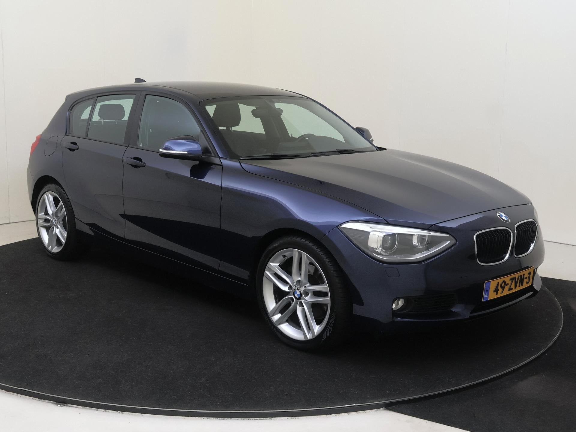 BMW 1-serie 118i Upgrade Edition | airco | bi-xenon koplampe, Auto's, Euro 5, Achterwielaandrijving, Gebruikt, Zwart
