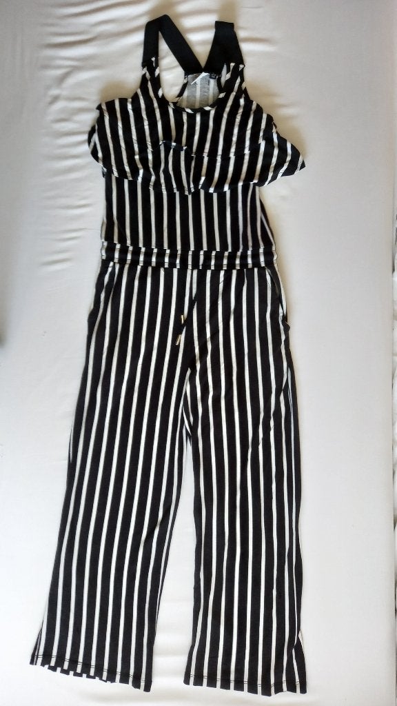 Retour jumpsuit zwart /wit gestreept 128, Ophalen of Verzenden, Gebruikt, Meisje