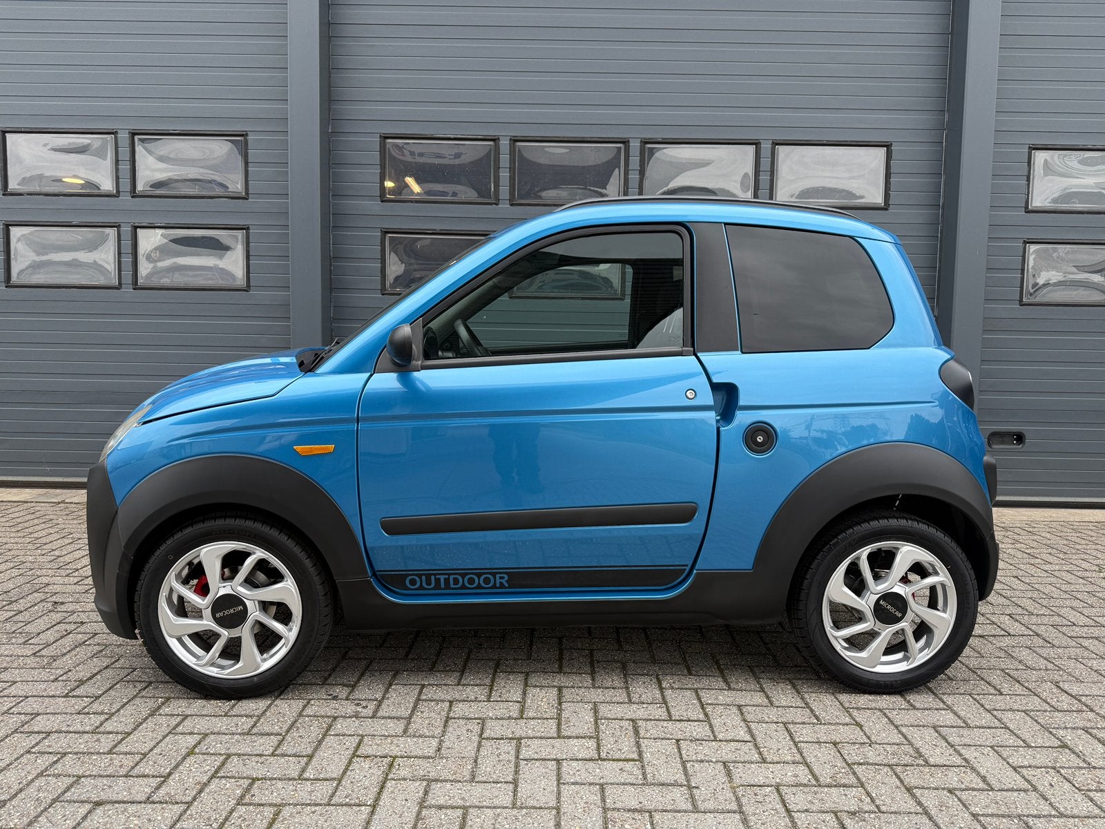Microcar M.Go 4 OUTDOOR Brommobiel 45KM / BLAUW / DCI / 2018