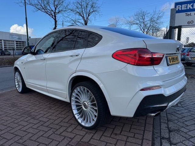 BMW X4 xDrive20i High Executive M-Edition Automaat Airco/ECC, Gebruikt, 4 cilinders, Wit, Bedrijf