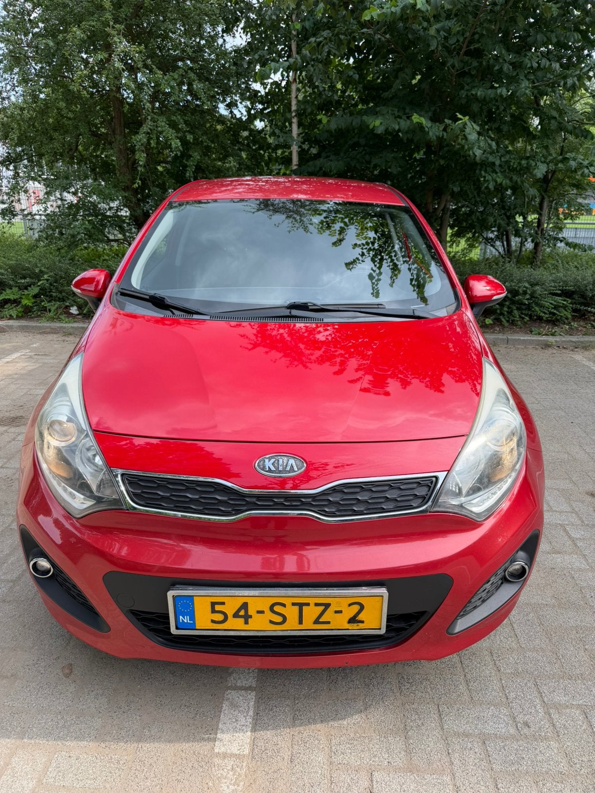Kia Rio 1.2 I 5DRS 2012 Rood, Auto's, Kia, Particulier, Rio, Airbags, Airconditioning, Bluetooth, Centrale vergrendeling, Elektrische ramen