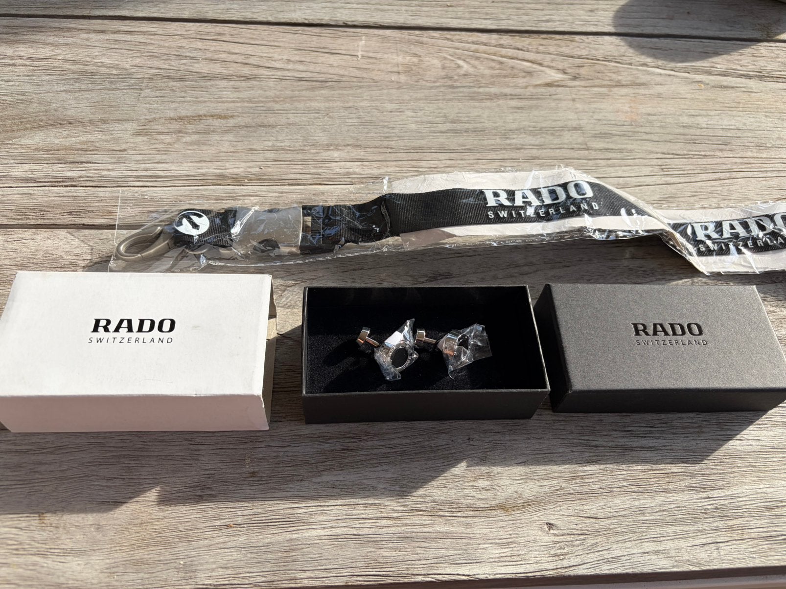 Rado manchetknopen en keycord - nieuw, Ophalen of Verzenden, Nieuw, Staal, Overige merken