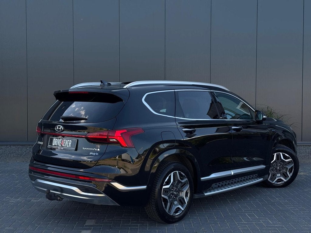 Hyundai Santa Fe 1.6 T-GDI PHEV Premium Sky 7p. BTW FULL PAN, Auto's, Hyundai, Santa Fe, Zwart, 4 cilinders, Met garantie (alle)