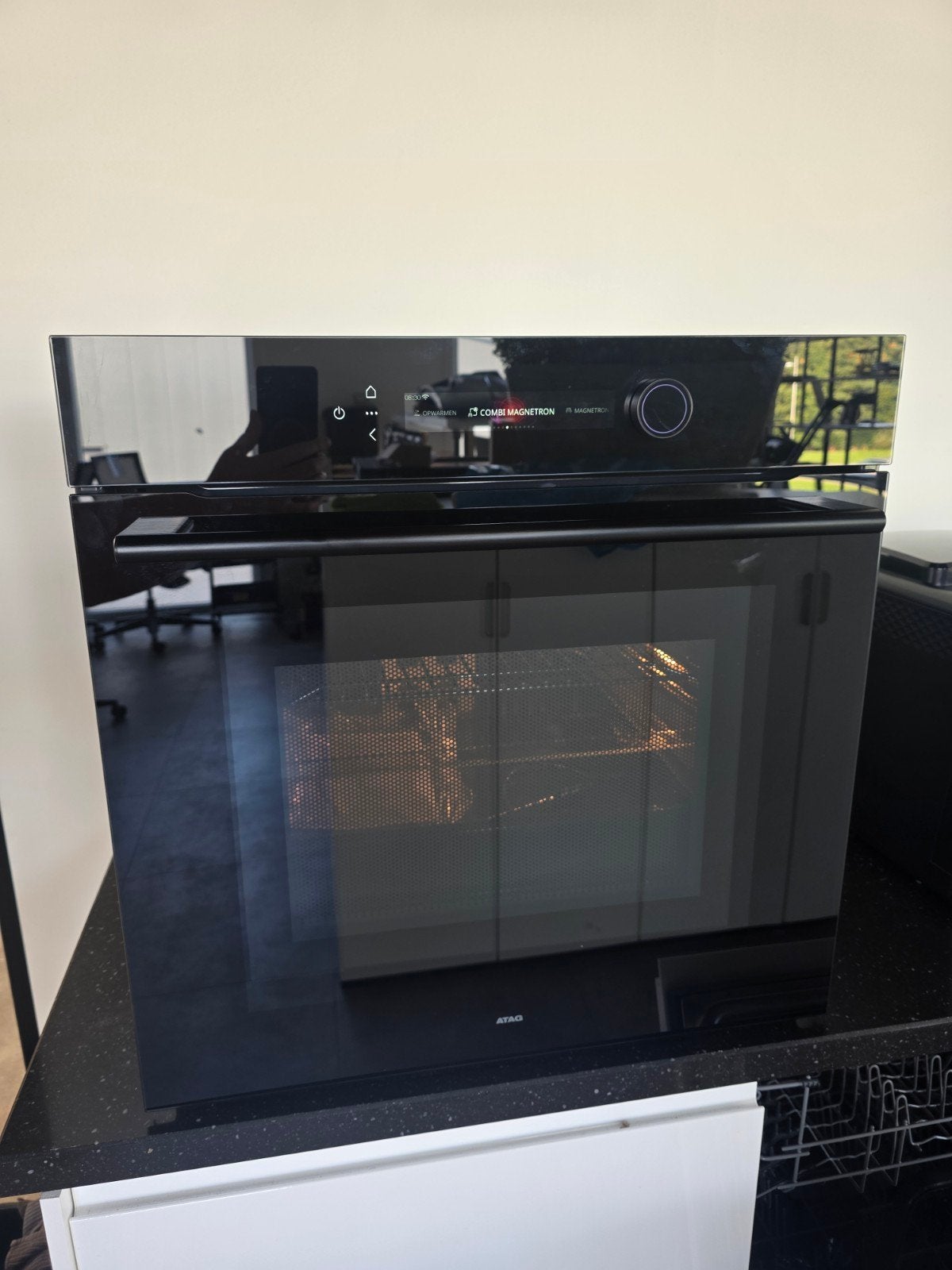Nieuw uit nieuwe keuken: ATAG CX8671D combi-oven Black Glass, Ophalen, Nieuw, Combi-oven, 55 tot 60 cm