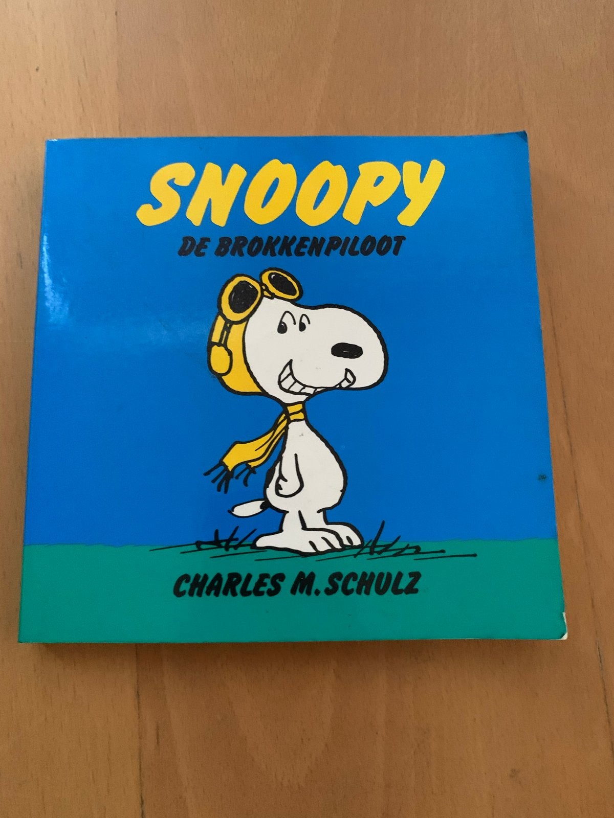 Snoopy: De Brokkenpiloot - Charles M. Schulz stripboek, Boeken, Eén stripboek, Ophalen of Verzenden, Gelezen