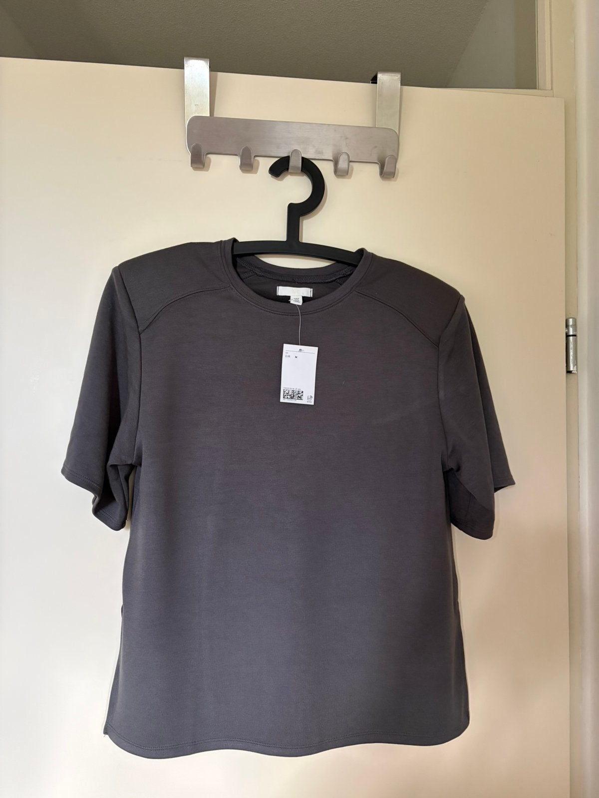 Nieuwe top van modalmix H&M grijs schoudervullingen maar M, Kleding | Dames, Maat 38/40 (M), Nieuw, Ophalen of Verzenden, Korte mouw
