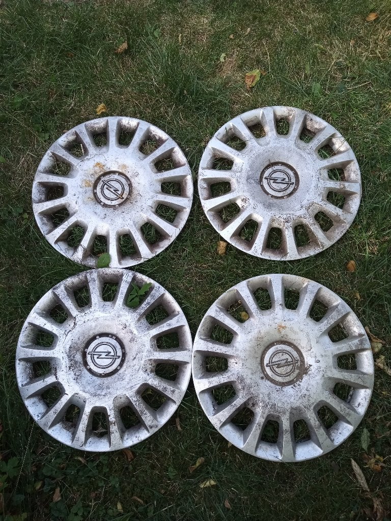 4x originele Opel Corsa D wieldoppen 14” inch, Ophalen, Gebruikt